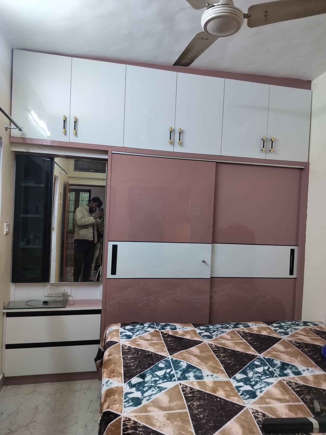 Pink sliding wardrobe with mirror dresser unit